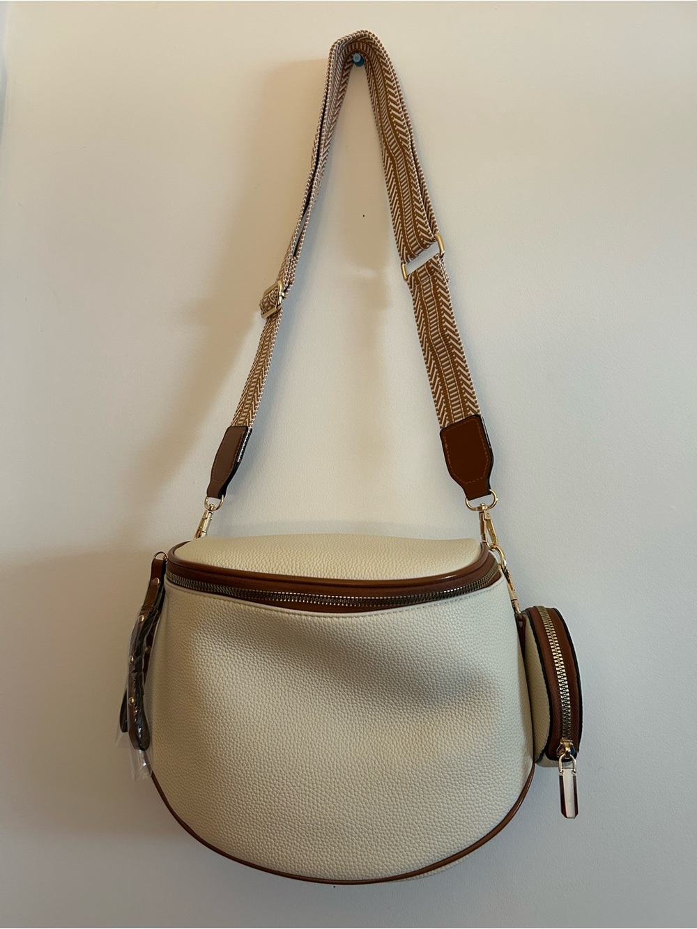 Cream Saddle Shoulder Bag with Brown Trim and Patterned Strap